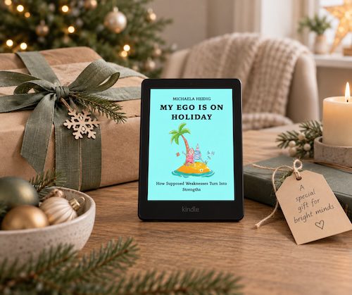 My Ego Is on Holiday eBook beside a wrapped Christmas gift for a teacher